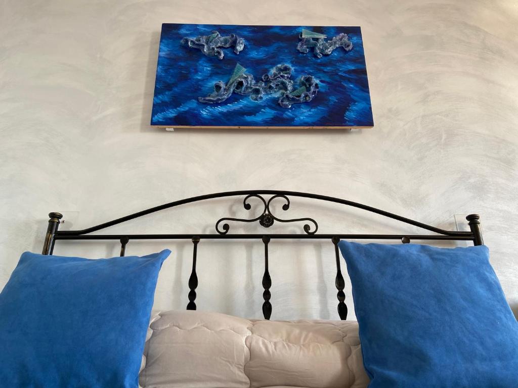 A bed or beds in a room at Ulisse Maison de Charme