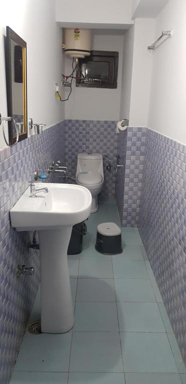 Koupelna v ubytování SHIVANI HOME STAY