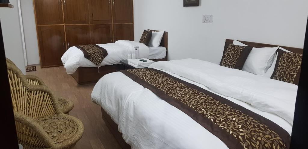 Postel nebo postele na pokoji v ubytování SHIVANI HOME STAY
