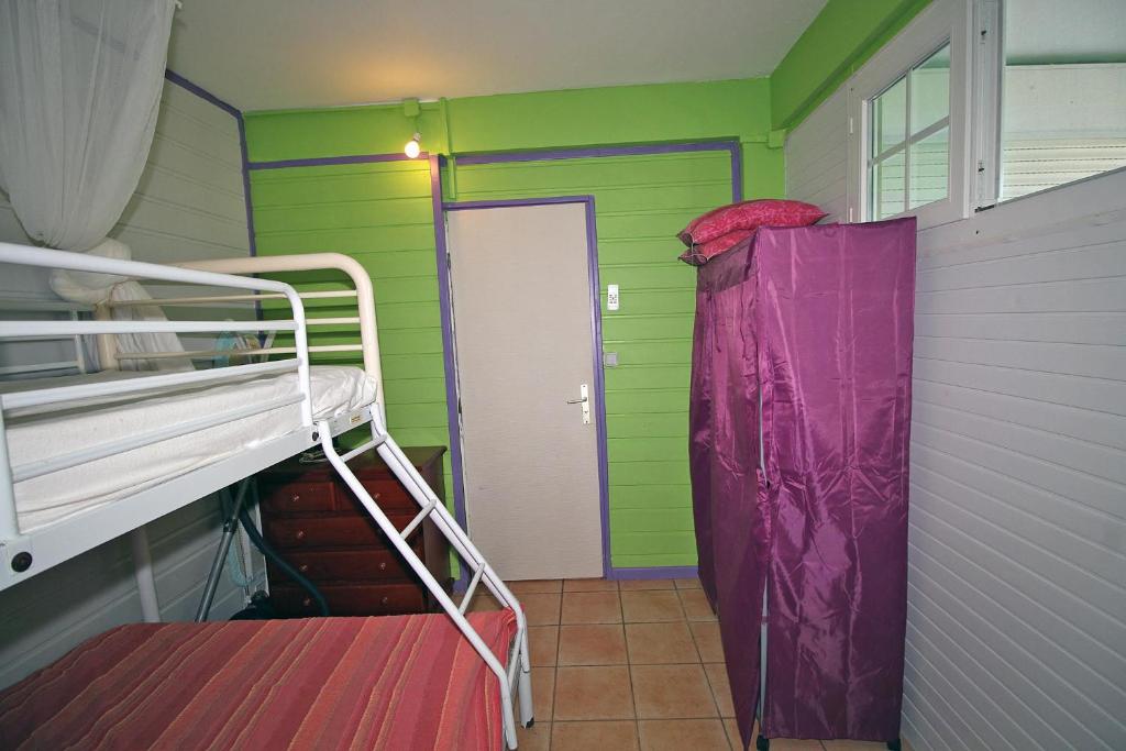 Postel nebo postele na pokoji v ubytování CHEZ JOJO