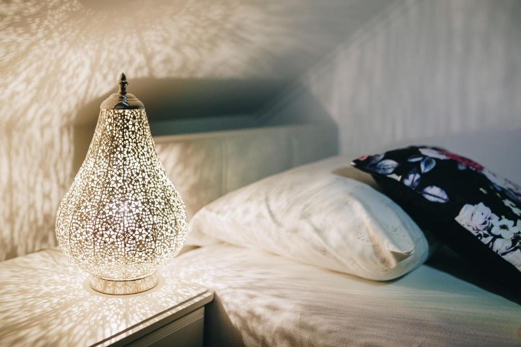 Postel nebo postele na pokoji v ubytování Grom Ribno Apartments