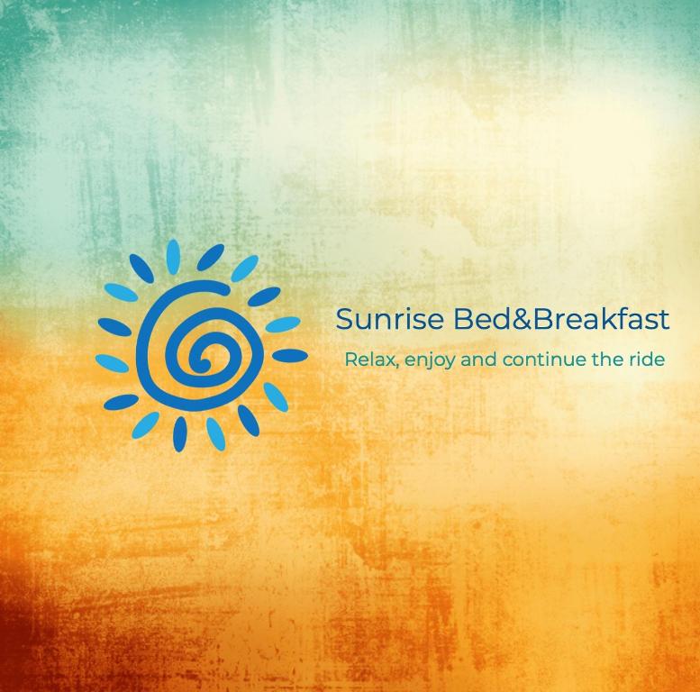 una imagen de un logotipo más brillante en un fondo naranja en Sunrise by A-1, en Alajuela