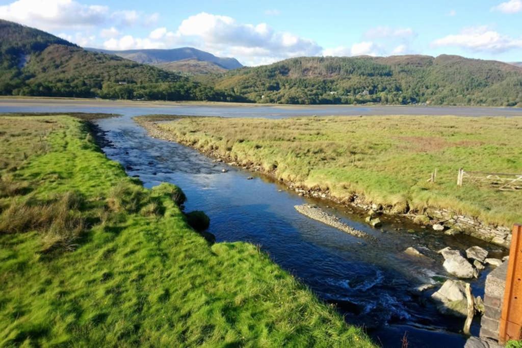 an aerial view of a river in a field at Abergwynant Farm Glamping & Apartments in Dolgellau