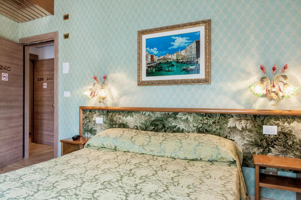 Postelja oz. postelje v sobi nastanitve Hotel Venezia