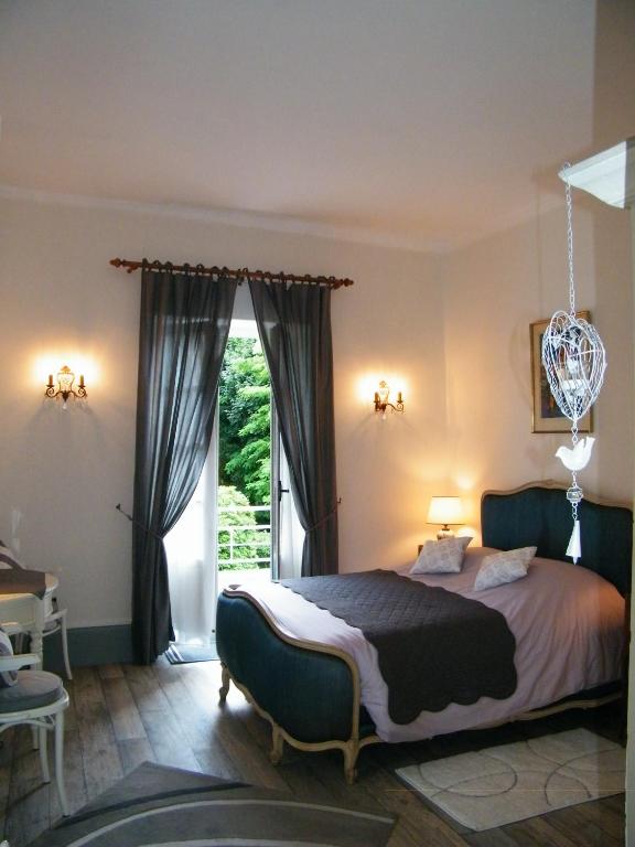 Voodi või voodid majutusasutuse Villa des Capucins toas