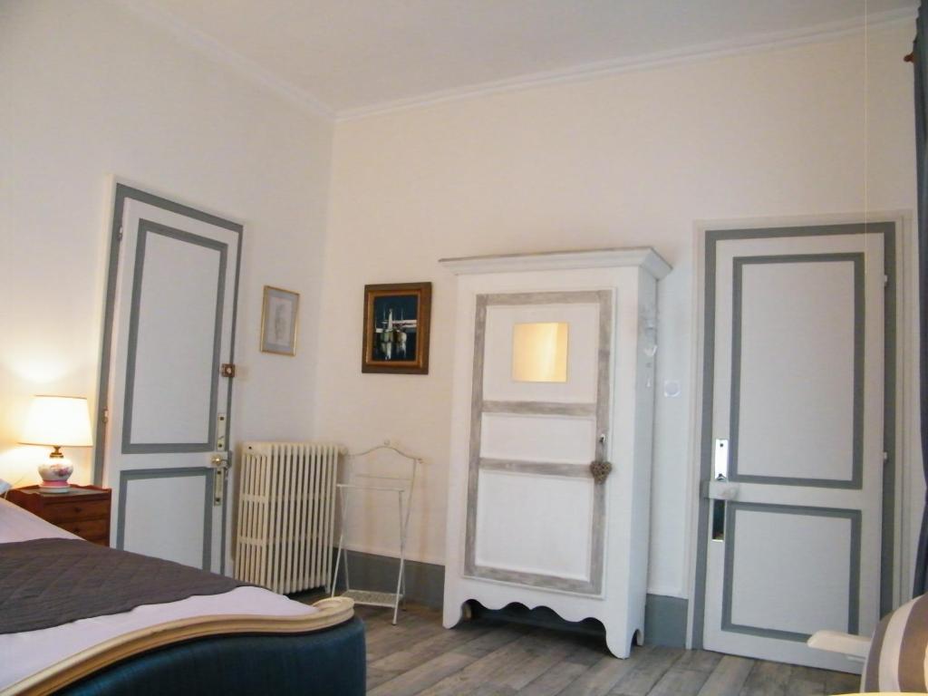 Voodi või voodid majutusasutuse Villa des Capucins toas