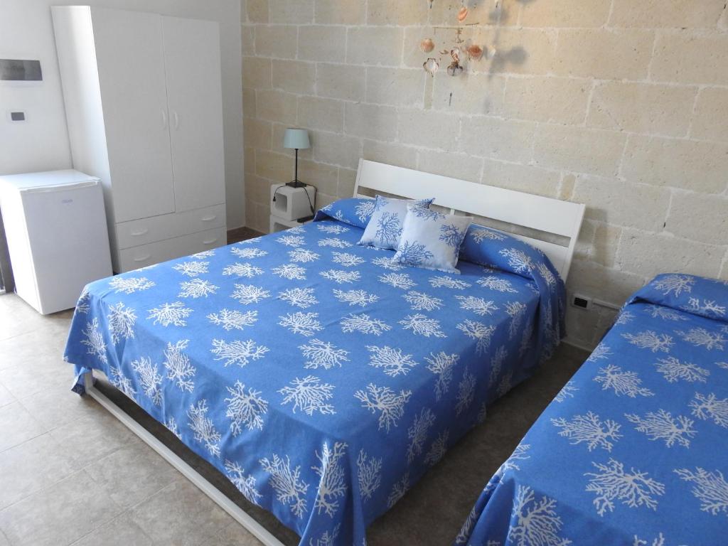 Кровать или кровати в номере Masseria Prisuti