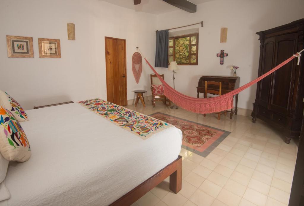 Postel nebo postele na pokoji v ubytování Hotel Posada San Juan