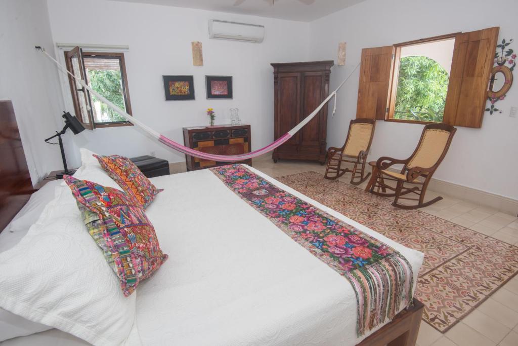 Postel nebo postele na pokoji v ubytování Hotel Posada San Juan