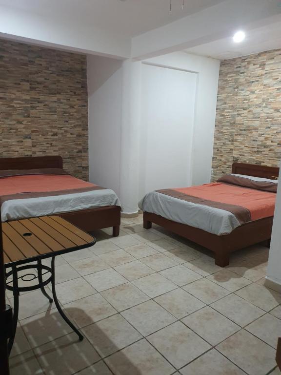 Postel nebo postele na pokoji v ubytování Hotel posada MARCAS