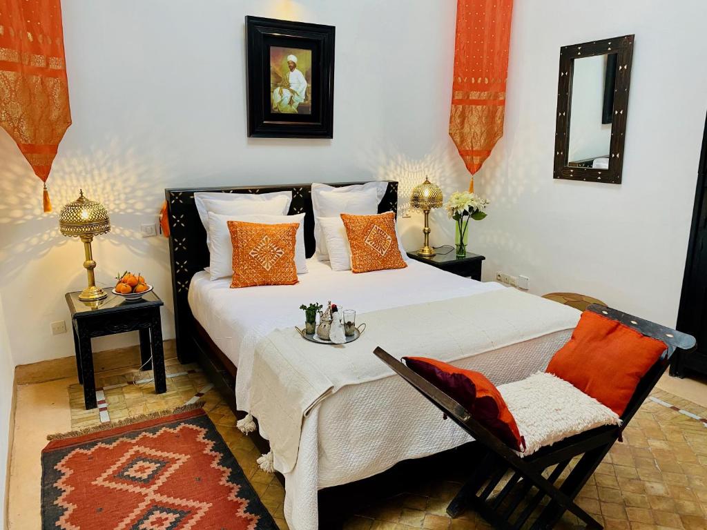 Ένα ή περισσότερα κρεβάτια σε δωμάτιο στο Riad Dar Balthazar