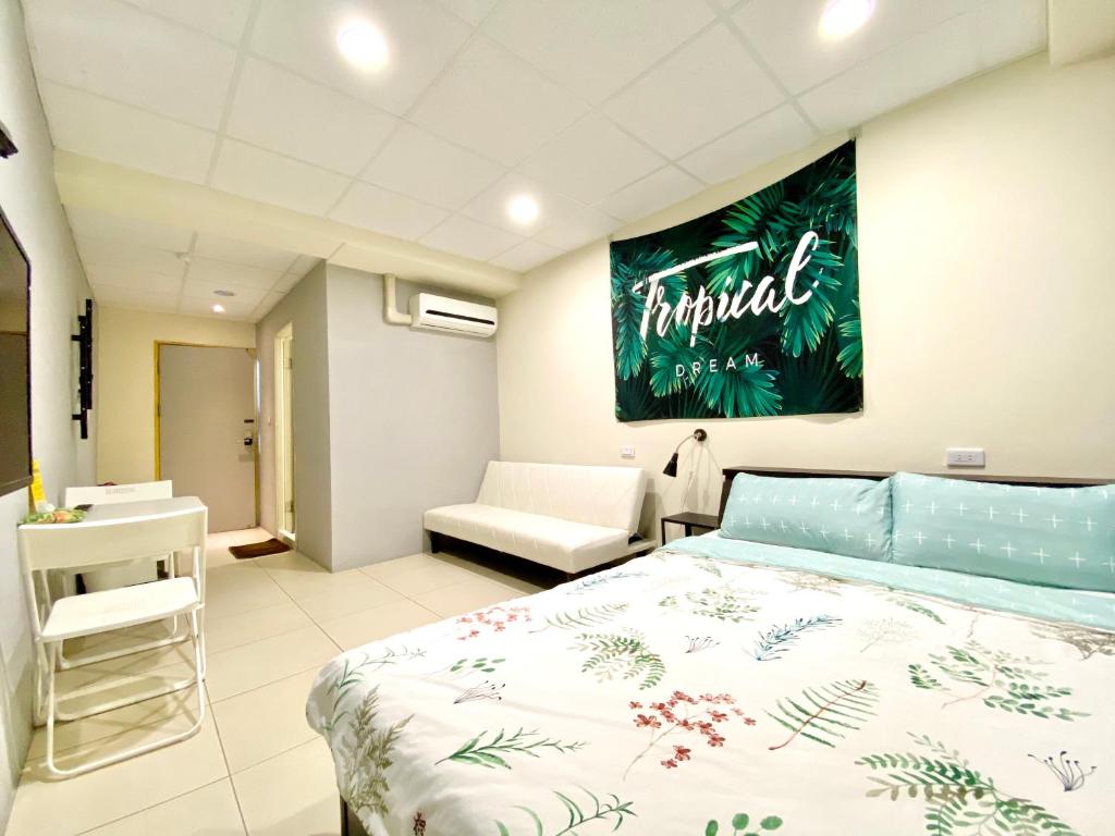 Postel nebo postele na pokoji v ubytování Wei Yang Guest House