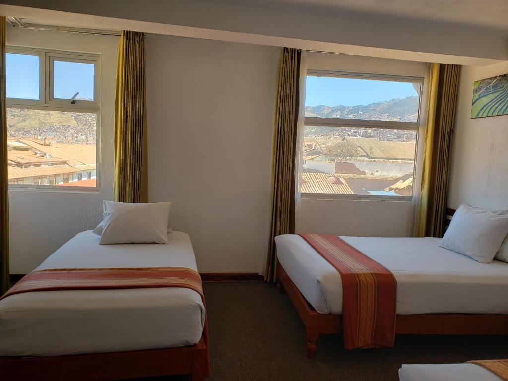 Postel nebo postele na pokoji v ubytování Hotel Sueños del Inka