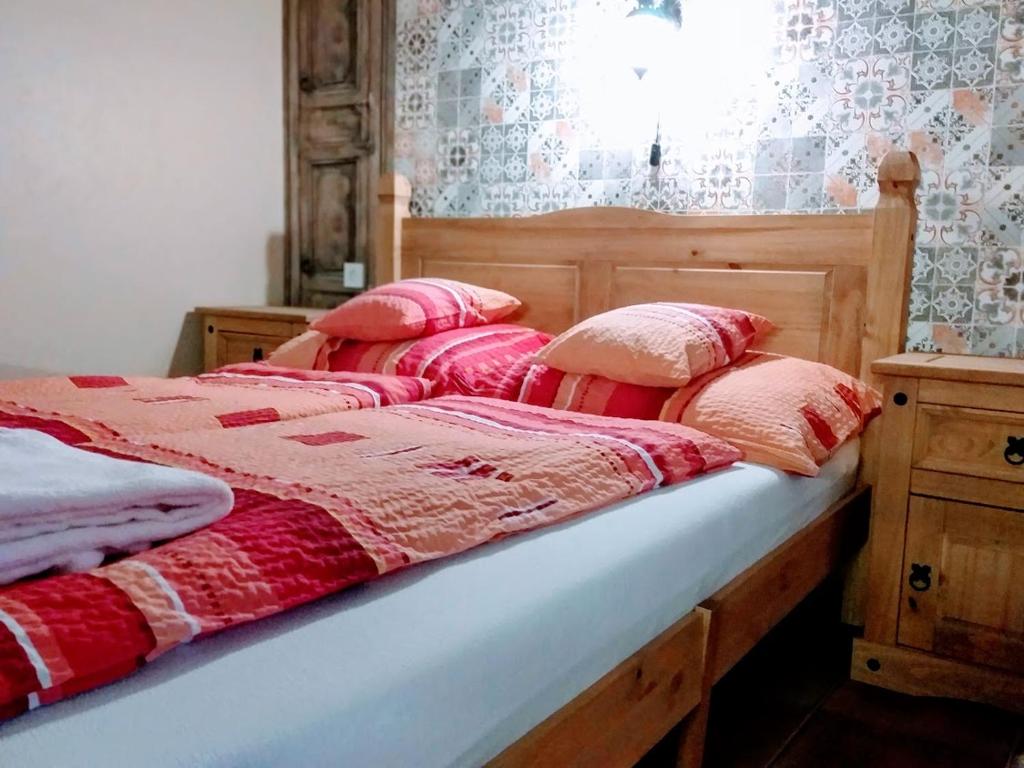 Postel nebo postele na pokoji v ubytování Hacienda Apartmanok