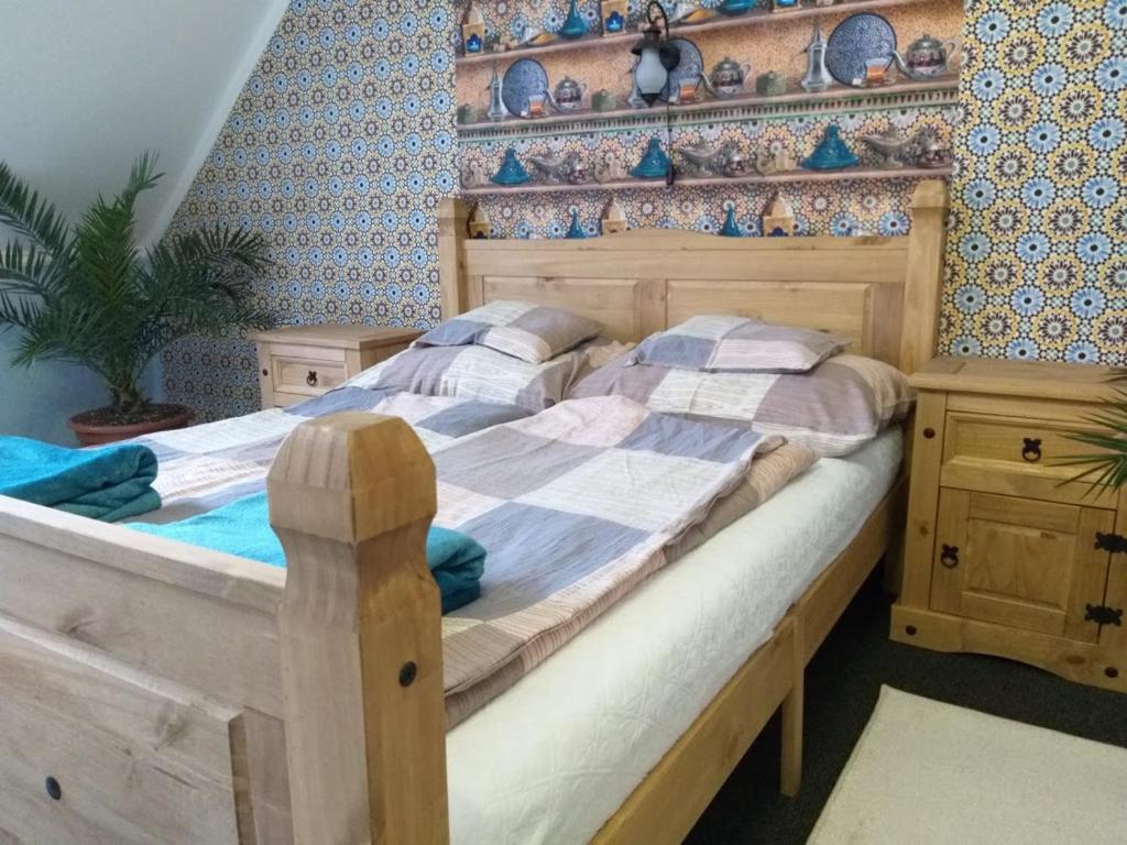 Postel nebo postele na pokoji v ubytování Hacienda Apartmanok