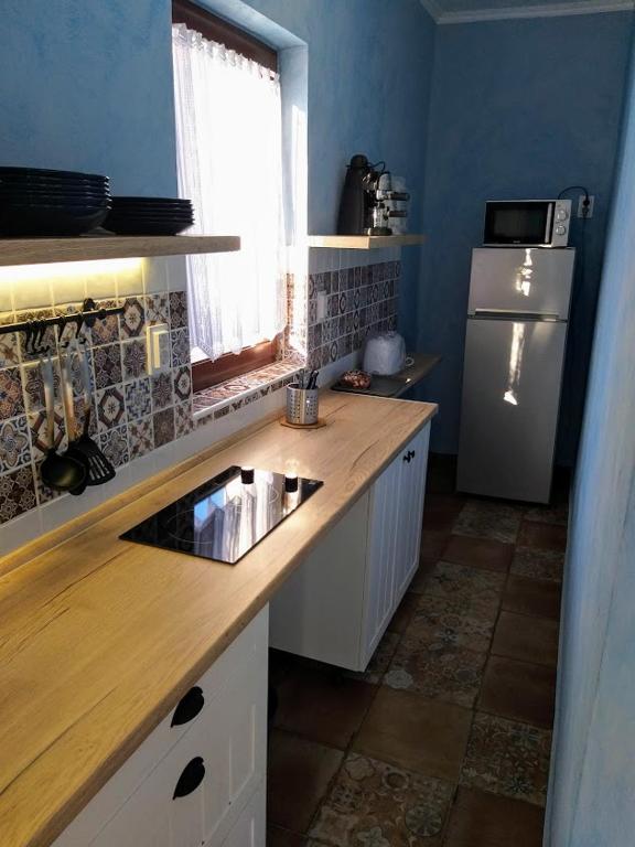 Kuchyň nebo kuchyňský kout v ubytování Hacienda Apartmanok