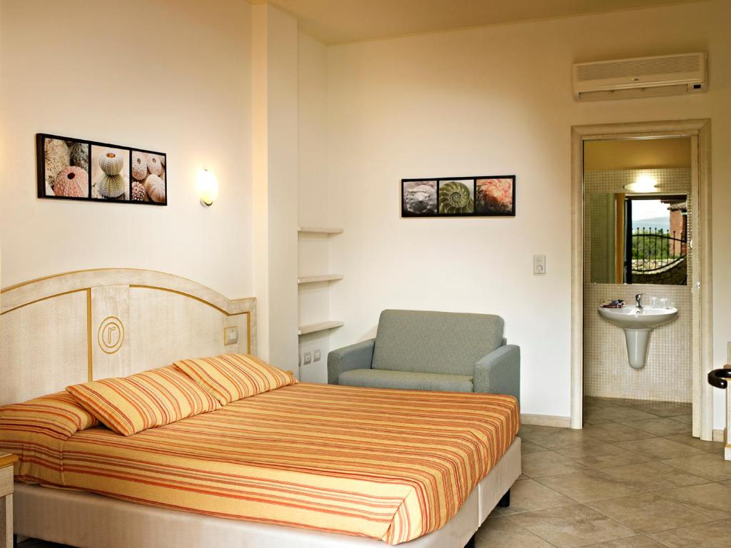 Łóżko lub łóżka w pokoju w obiekcie Hotel Raffael PHG