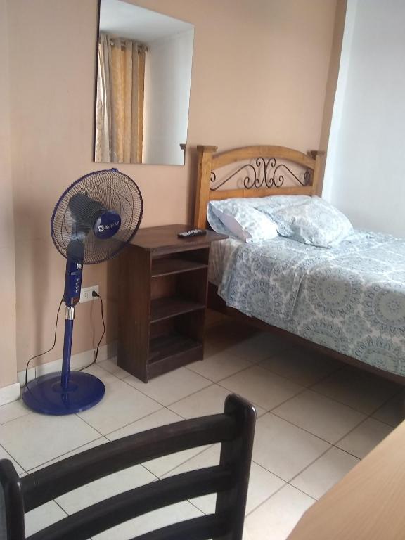Postel nebo postele na pokoji v ubytování Hospedaje Marita