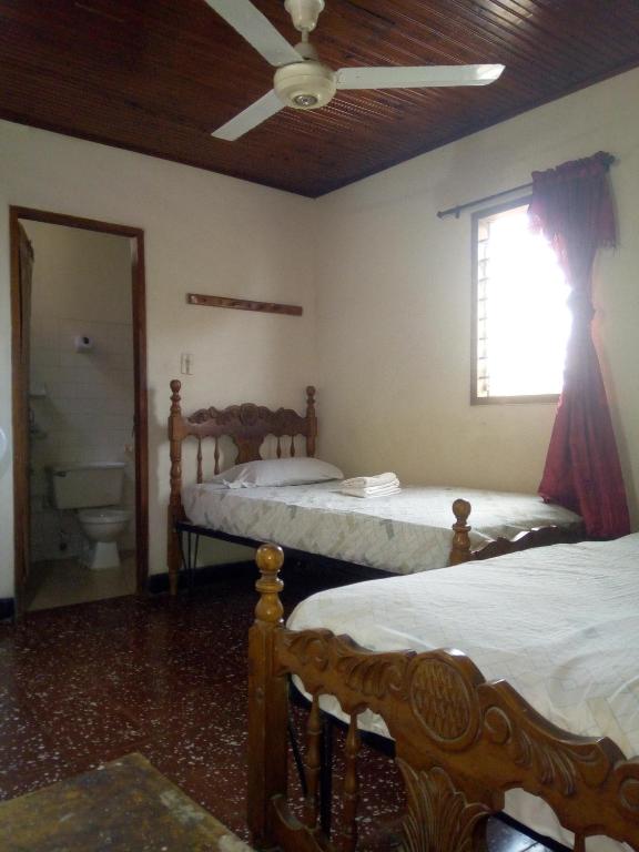 Postel nebo postele na pokoji v ubytování HOTEL en MONTERIA CITY