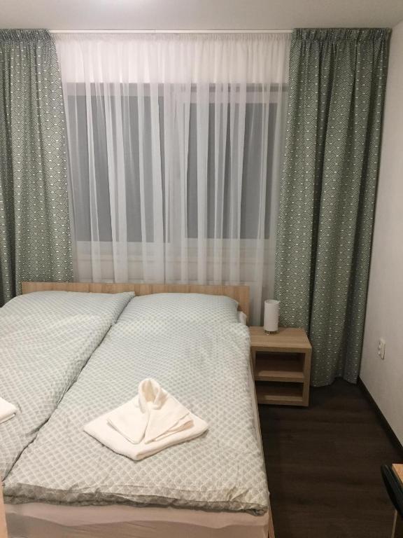 Postel nebo postele na pokoji v ubytování Penzión Fistra