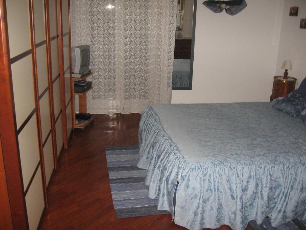 Кровать или кровати в номере Mondello Holidays
