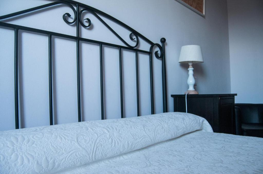 Postel nebo postele na pokoji v ubytování Apartamentos Corona