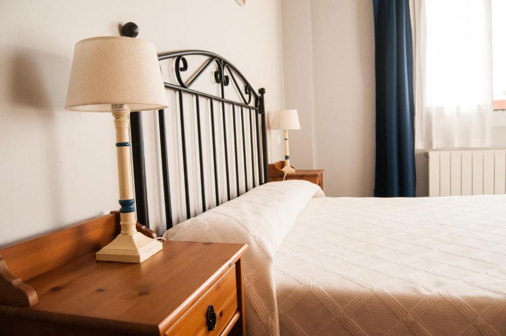 Postel nebo postele na pokoji v ubytování Apartamentos Corona
