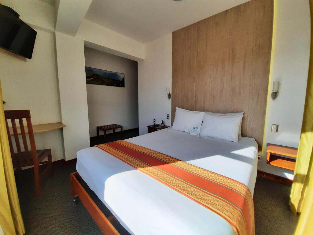 Postel nebo postele na pokoji v ubytování Hotel Sueños del Inka