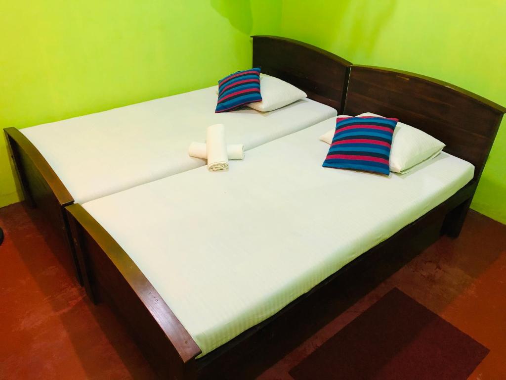 Postel nebo postele na pokoji v ubytování Kumari Guest House
