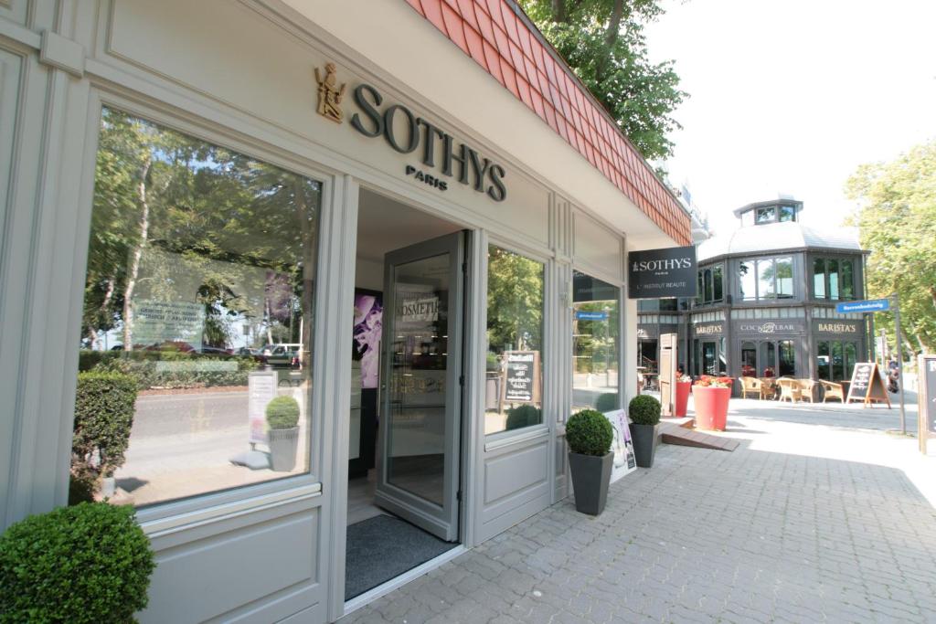 a store front with glass doors on a street at Europa Hotel Kühlungsborn in Kühlungsborn