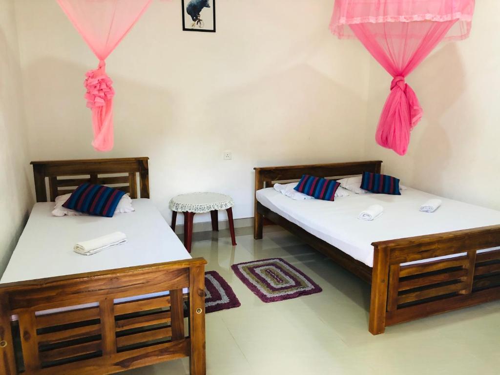 Postel nebo postele na pokoji v ubytování Kumari Guest House