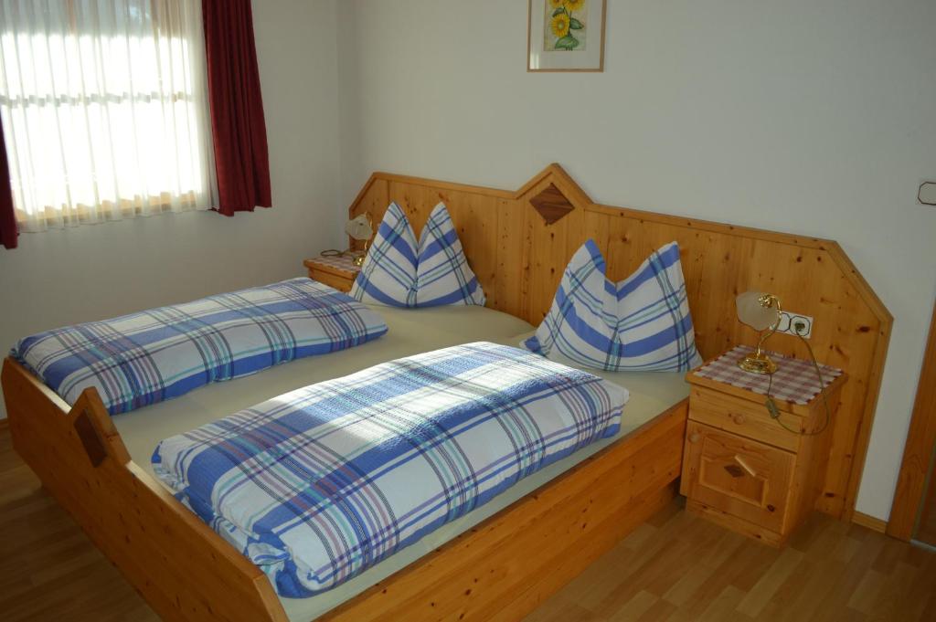 Postel nebo postele na pokoji v ubytování Residence Rogger