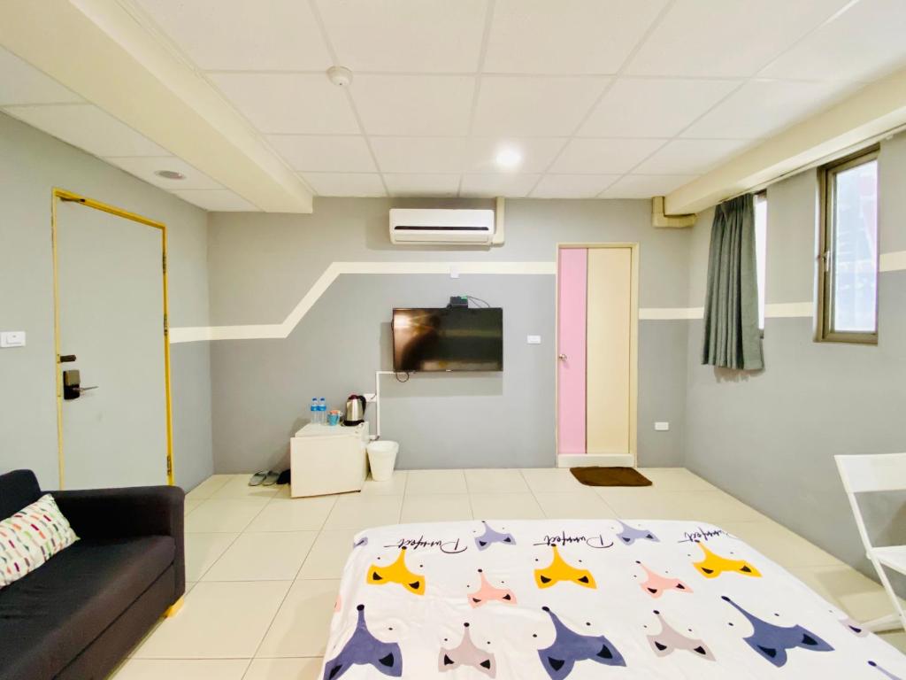 Postel nebo postele na pokoji v ubytování Wei Yang Guest House