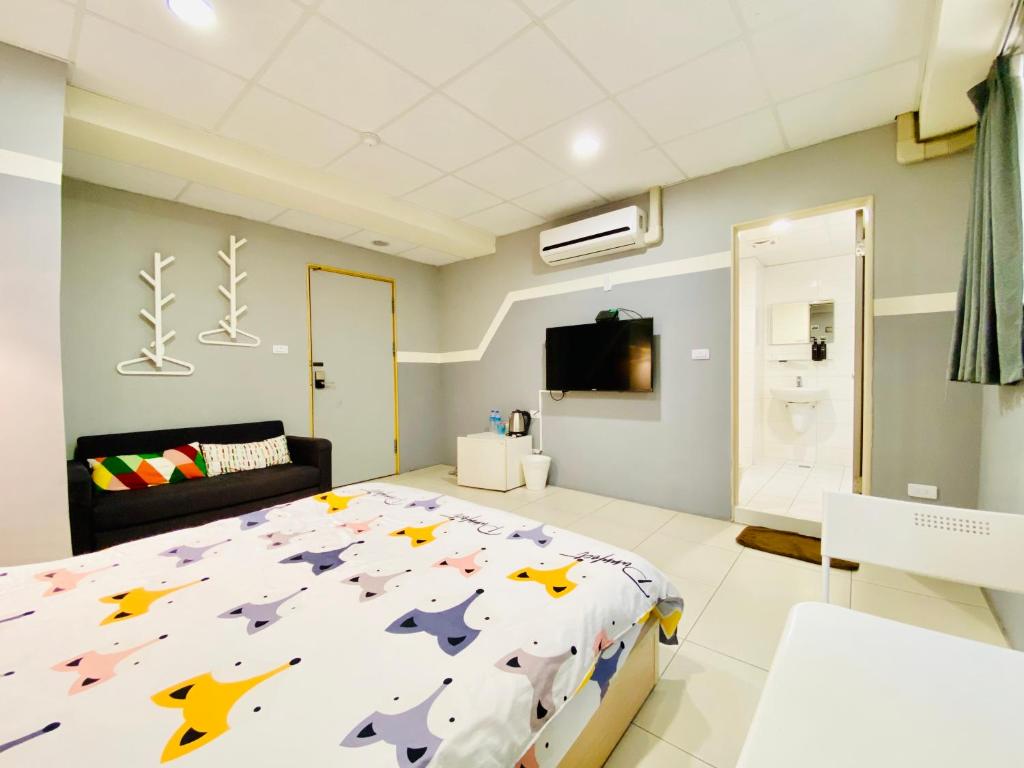 Postel nebo postele na pokoji v ubytování Wei Yang Guest House