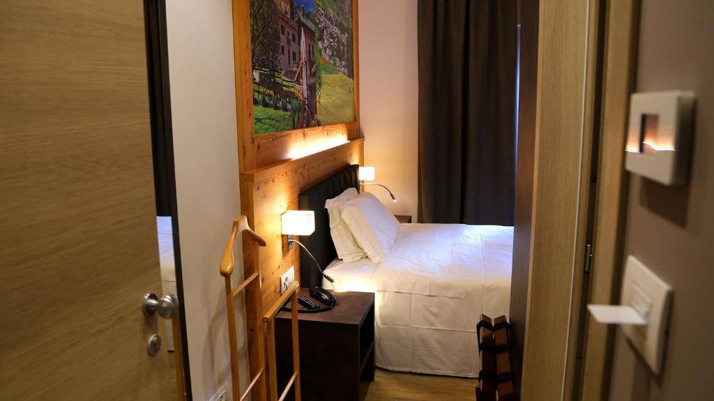 Postel nebo postele na pokoji v ubytování Dada Mountain Hotel