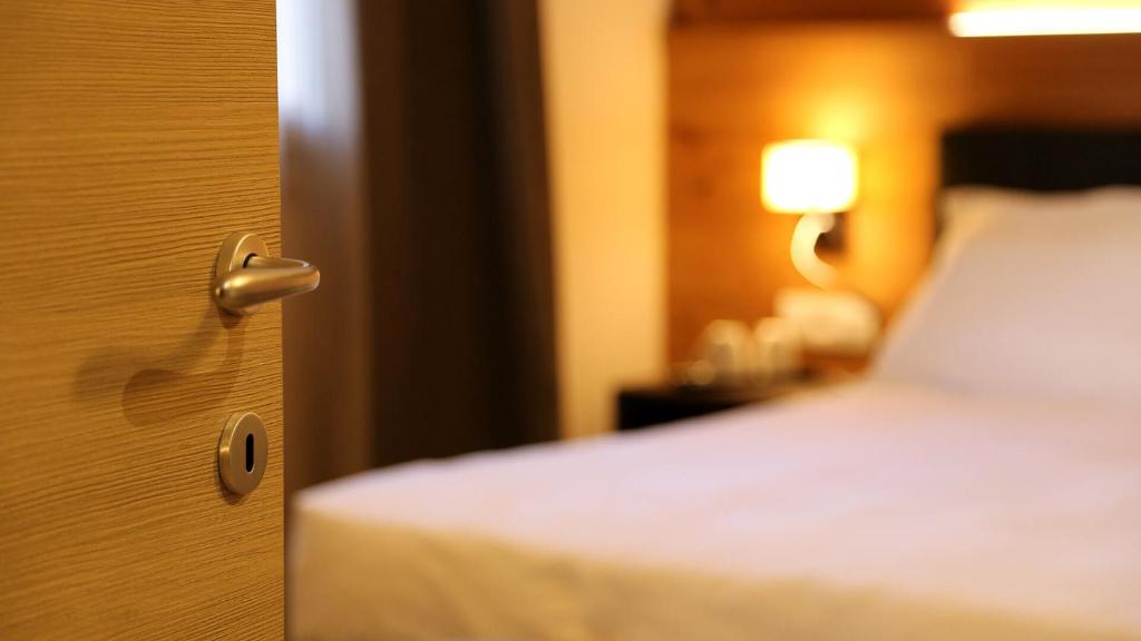 Postel nebo postele na pokoji v ubytování Dada Mountain Hotel