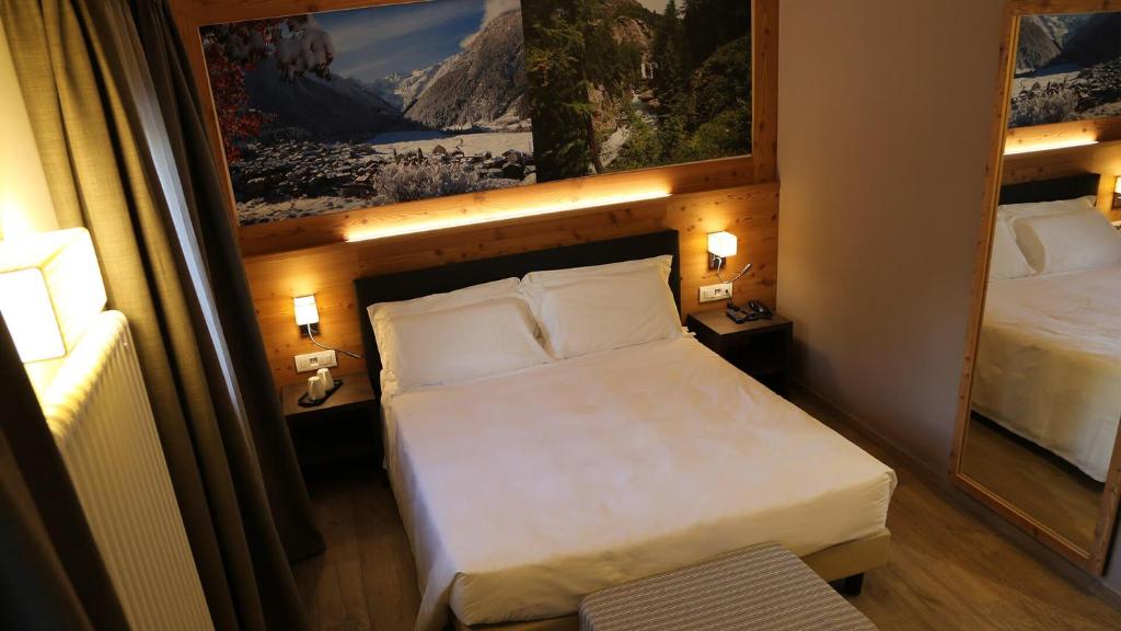 Postel nebo postele na pokoji v ubytování Dada Mountain Hotel