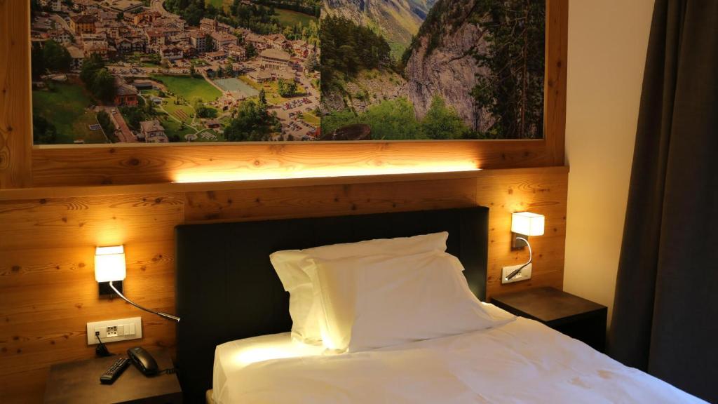 Postel nebo postele na pokoji v ubytování Dada Mountain Hotel