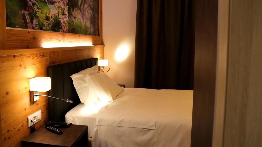 Postel nebo postele na pokoji v ubytování Dada Mountain Hotel