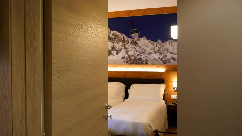 Postel nebo postele na pokoji v ubytování Dada Mountain Hotel