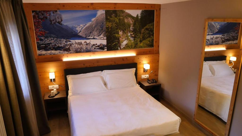 Postel nebo postele na pokoji v ubytování Dada Mountain Hotel