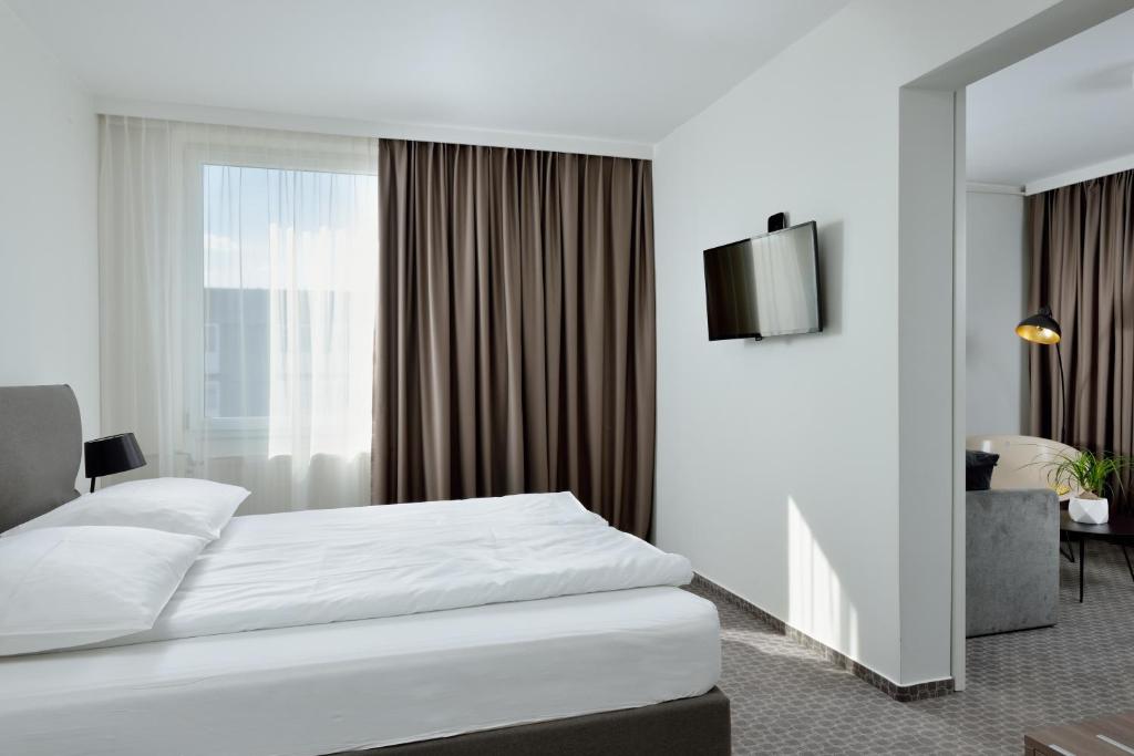 Postelja oz. postelje v sobi nastanitve B&B Hotel Ljubljana Park