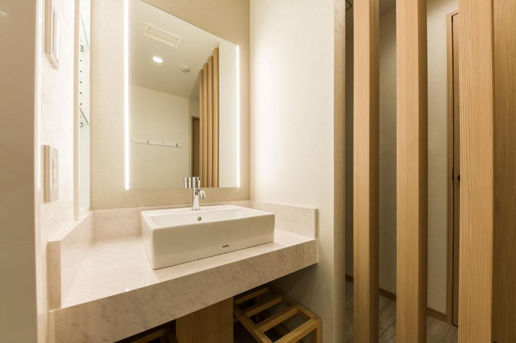 Koupelna v ubytování IAM HOTEL