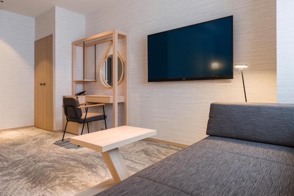 TV a/nebo společenská místnost v ubytování IAM HOTEL