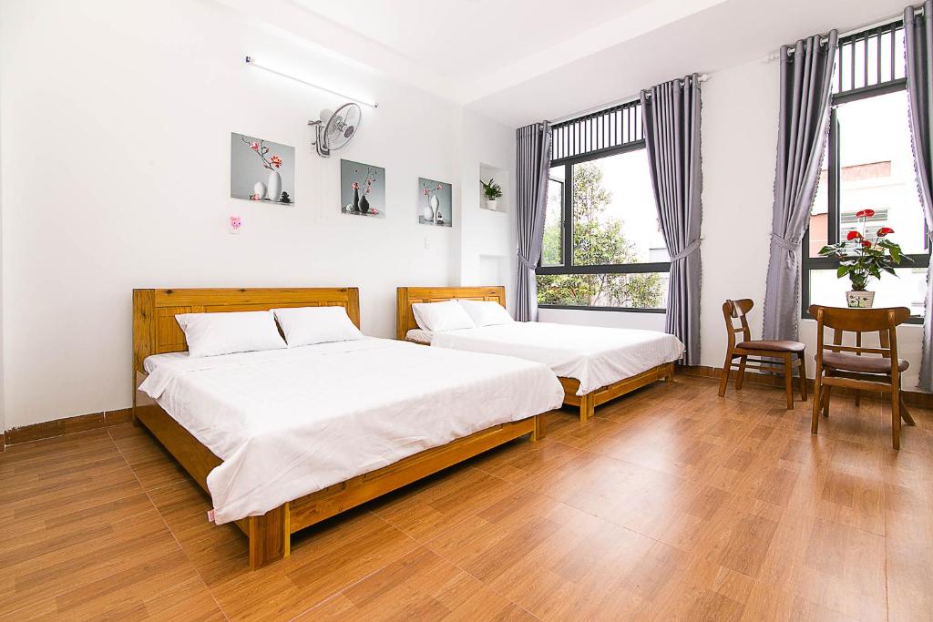 Giường trong phòng chung tại SPOT ON 806 Net Viet Homestay