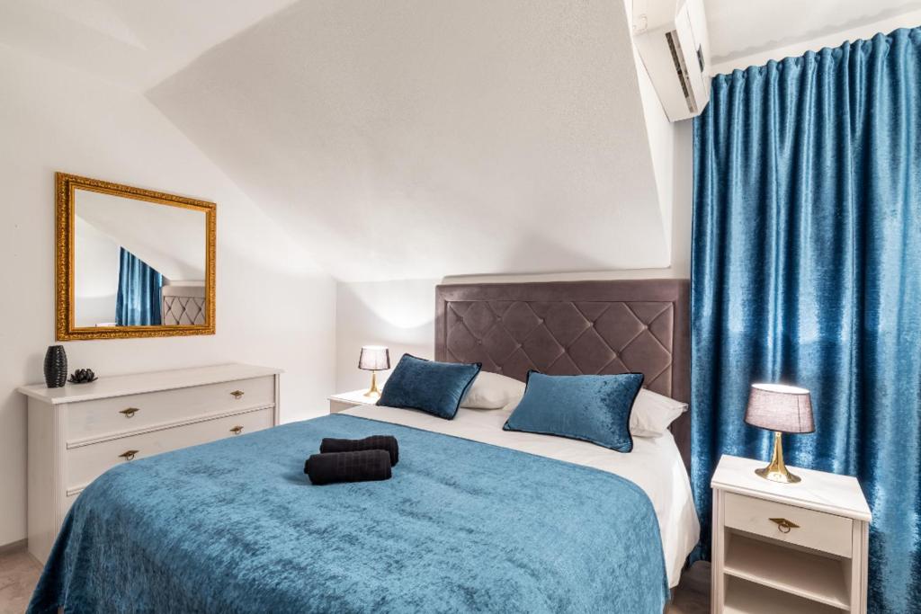 Łóżko lub łóżka w pokoju w obiekcie Apartments Sonja