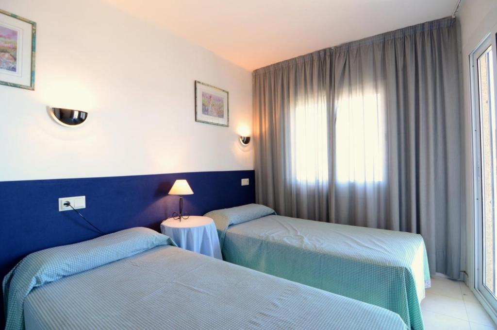 A bed or beds in a room at Rocamaura I B 4-2