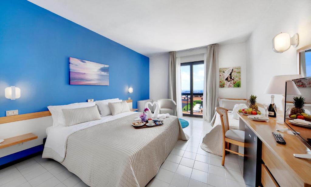 Voodi või voodid majutusasutuse I Giardini di Athena- Athena Resort toas