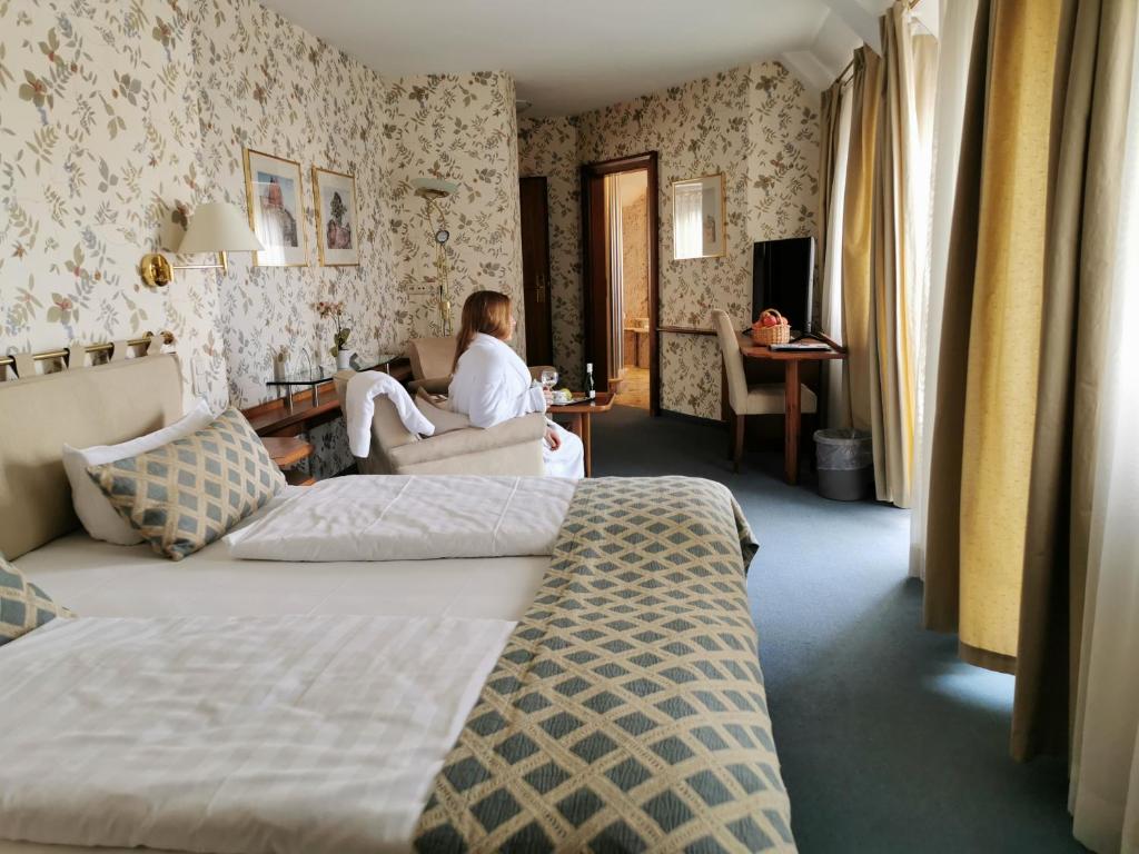 Postel nebo postele na pokoji v ubytování Hotel Cristal