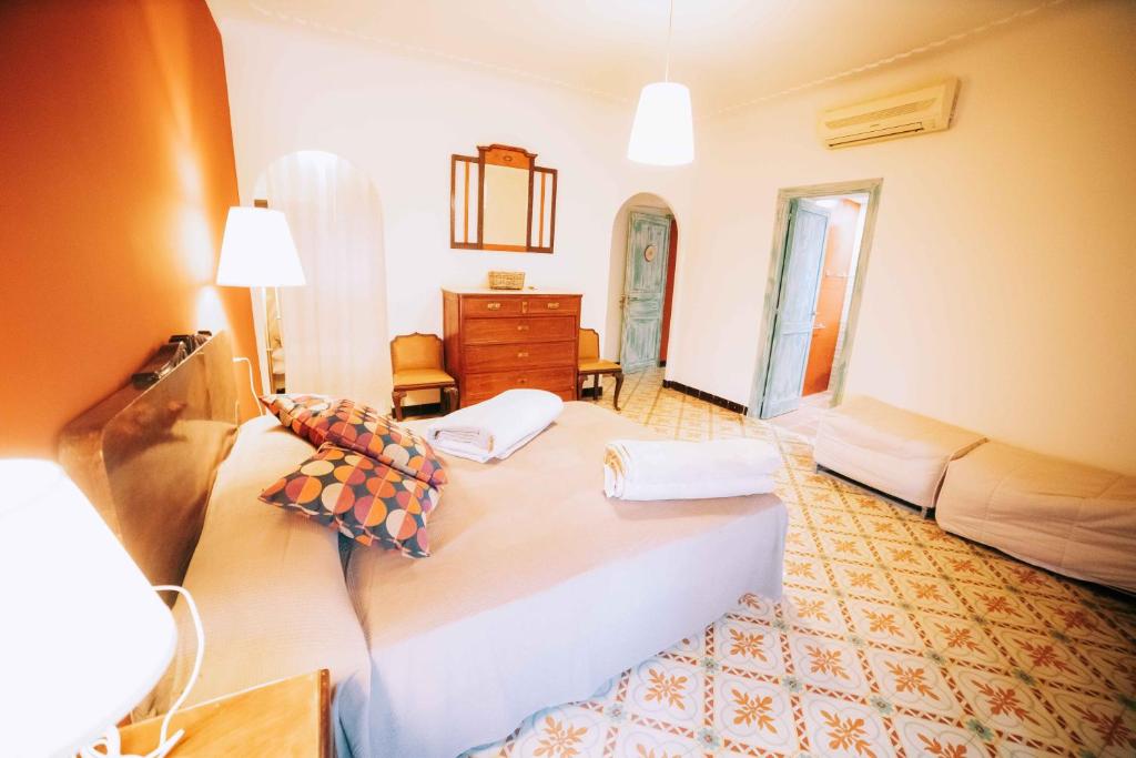 a room with two beds and a couch in it at Casa con piscina privada en Gualta, CAN BLAY in Gualta